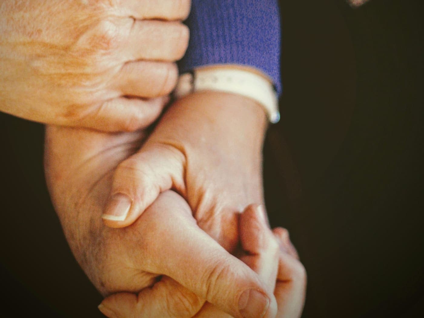 Hands clasped together